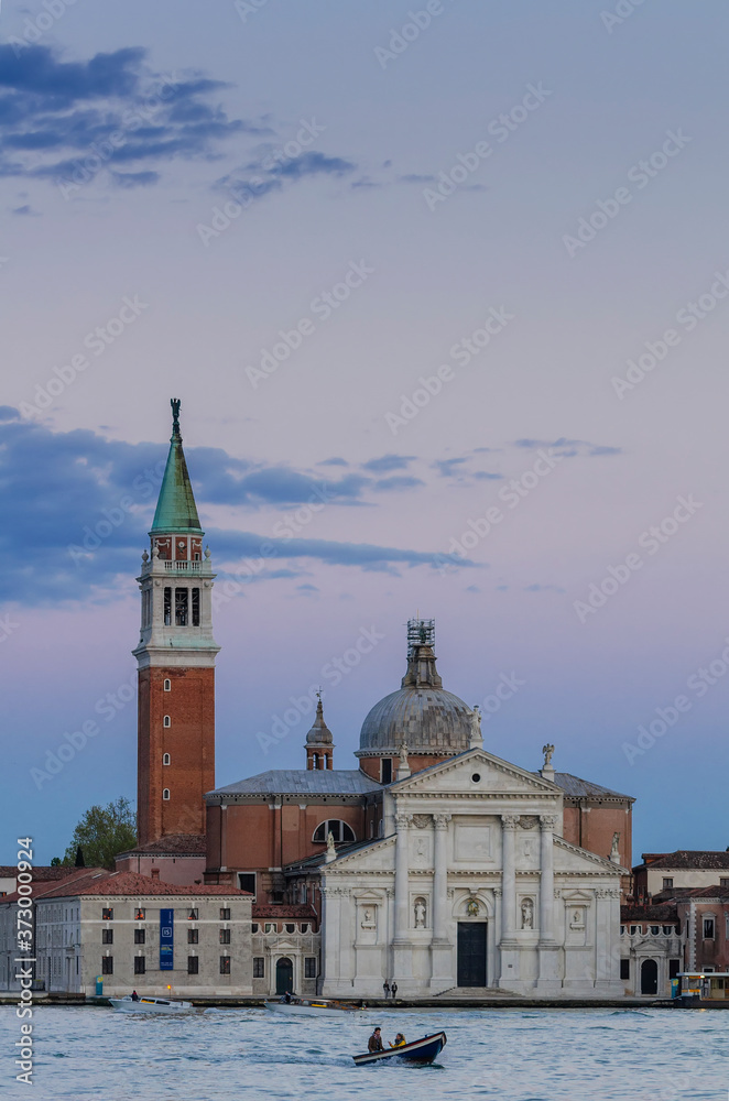 Venice at sunset, view of the Church of San Giorgio Maggiore.Set on an island, an art-filled, bright white church by Palladio giving Venice views from its tower.
