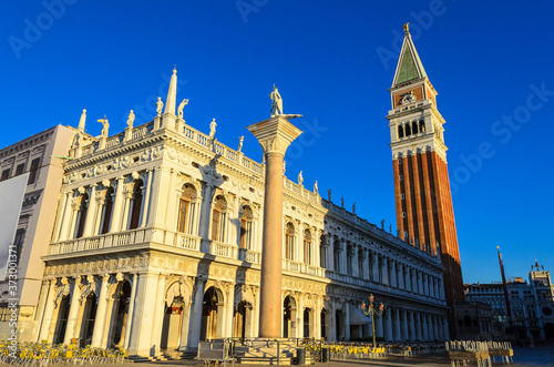 National Library Marciana (Biblioteca Nazionale Marciana) with St Mark's Campanile (Campanile di San Marco) on the background and Saint Mark and Saint Theodore Column in front. Venice. Italy