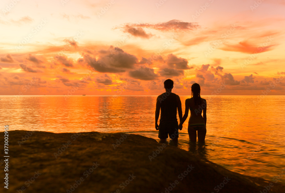 couple on the beach at sunset