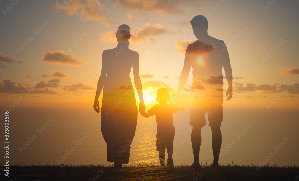 Family holding hands walking into the sunset. Family relationship, looking to the future concept. 