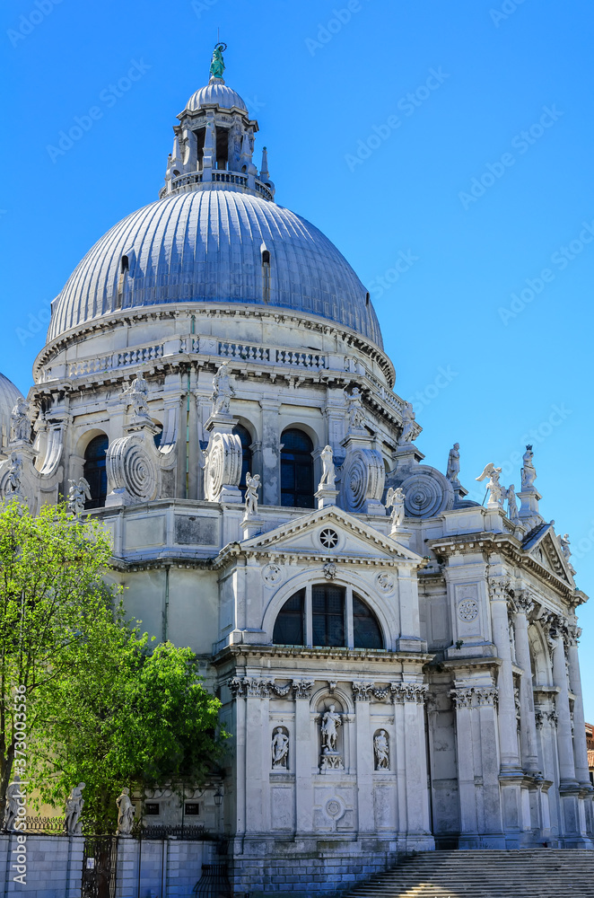 Basilica of Santa Maria della Salute ( Basilica di Santa Maria della Salute).Spectacular domed baroque church with unique octagonal design & sacristy housing 12 works by Titian.Venice,Italy