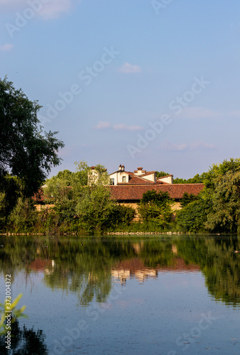 lake landscape with house reflected in water