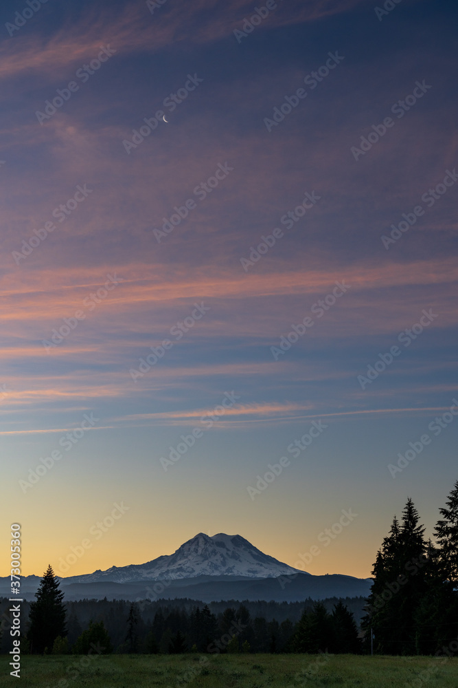 Sunrise and Pink Skies And Quarter Moon Above Mount Rainier On Warm July Morning