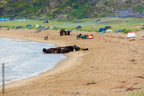 Coast of  Barents sea, Arctic ocean, the Kola Peninsula, Teriberka, Russia. Landmark in Teriberka russia popular place for tourism. Stones on the beach of Teriberka village photo