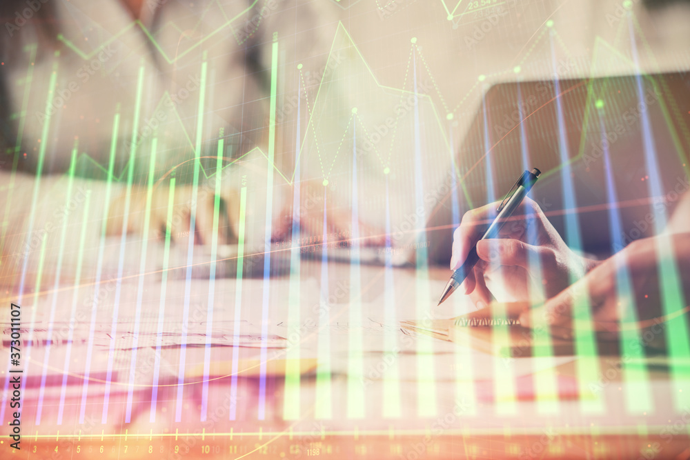 Multi exposure of woman hands typing on computer and forex chart hologram drawing. Stock market analysis concept.