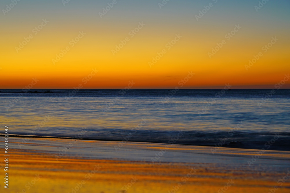 Dramatic orange sunset over the Playa Virador beach in Peninsula Papagayo in Guanacaste, Costa Rica