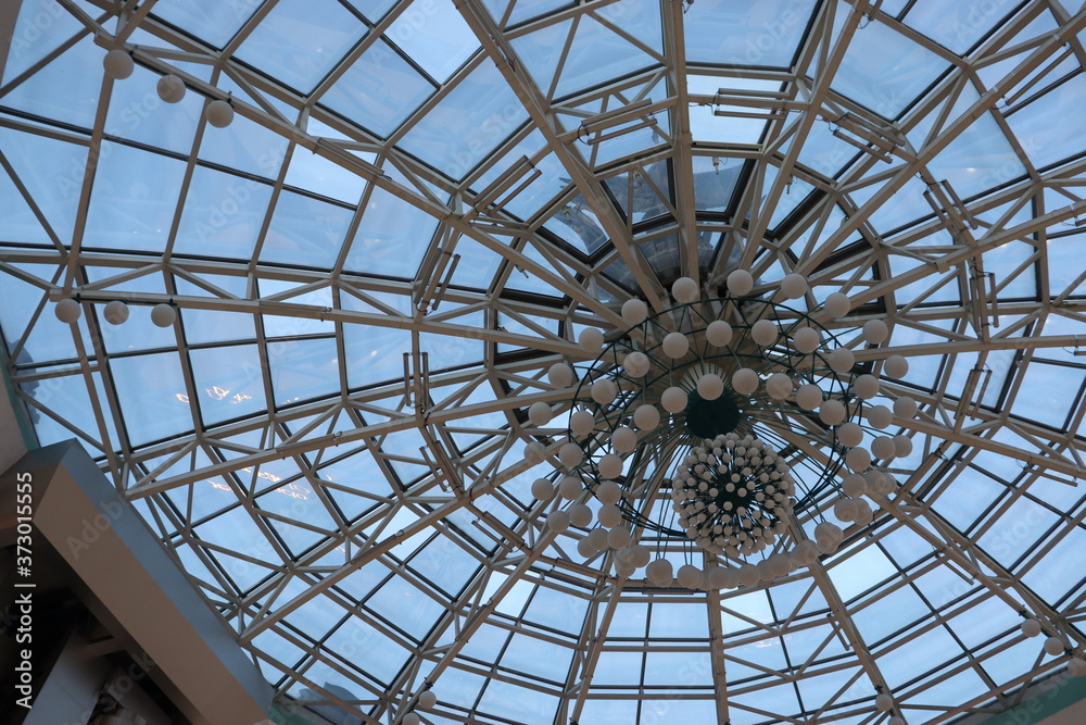 huge lustra hanging on malls ceiling