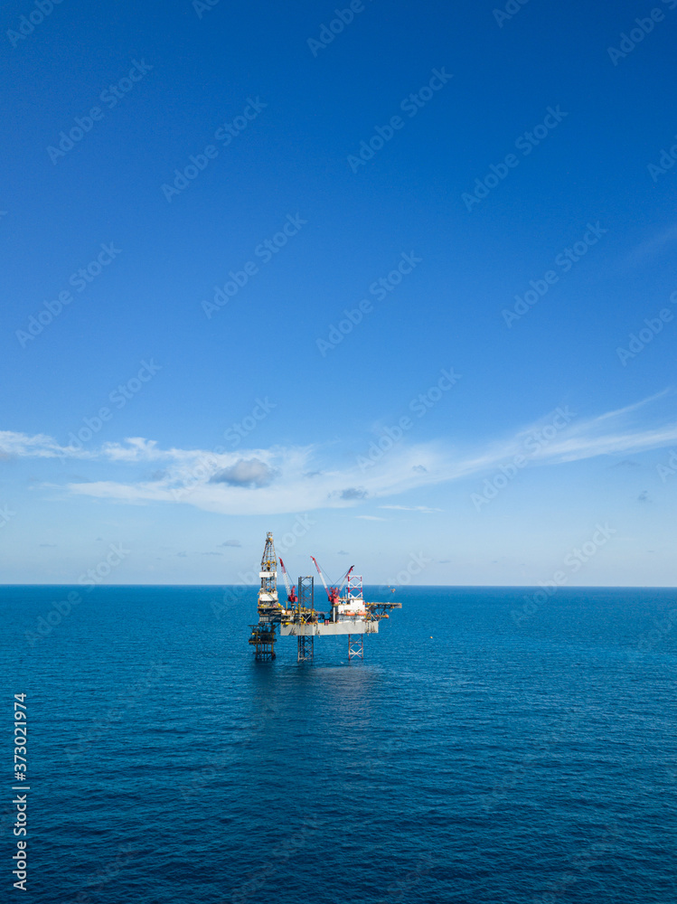 Aerial view from a drone of an offshore jack up rig at the offshore location during day time