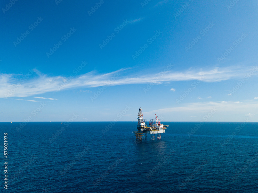 Aerial view from a drone of an offshore jack up rig at the offshore location during day time