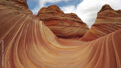 The Wave in North Coyote Buttes in Arizona. Several gimbal shots smoothly gliding over striped redrock. 4k footage. photo