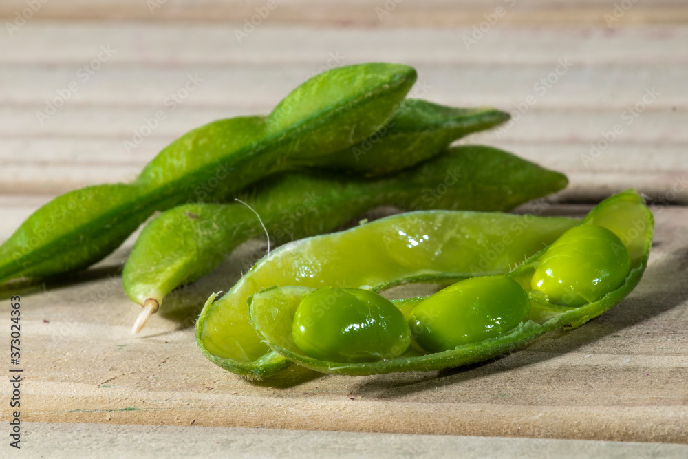 Edamame beans or green soybeans on the wooden table in Brazil Edamame beans or green soybeans on the wooden table in Brazil