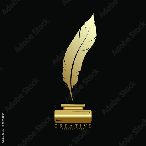 Gold Feather Pen Above Ink Holder