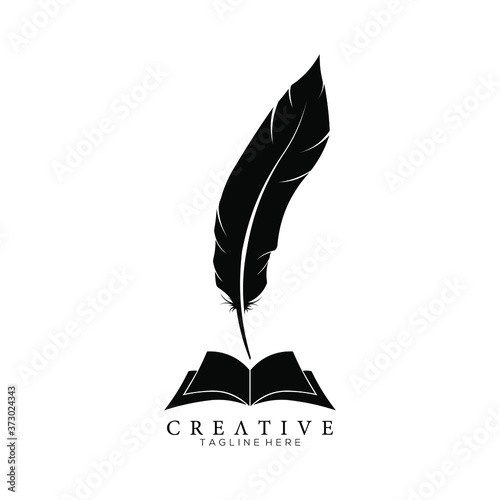 Black Feather Pen above an Open Book