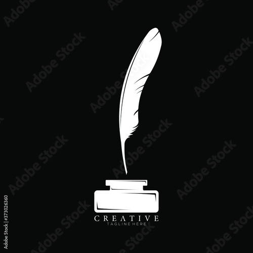 White Feather Pen Above Ink Holder