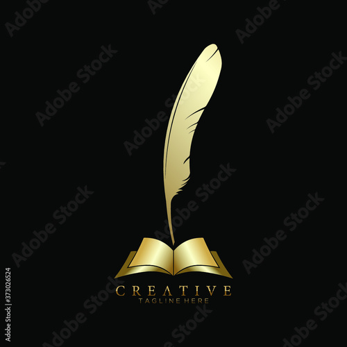 Gold Feather Pen above an Open Book