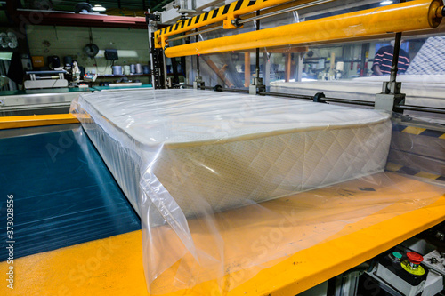 The machine for vacuum packing of orthopedic mattresses, vacuum packing of a mattress, production of orthopedic mattresses in a furniture factory. in south korea