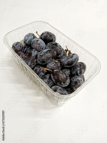 Plums in a package isolated...