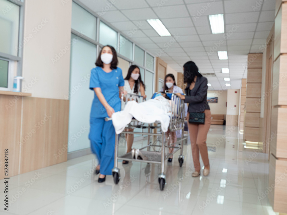 hospital emergency room male doctor and female nurse run hallway patient move go to accident operation for treatment health care surgeon covid-19 corona virus disease hospital emergency room male doctor and female nurse run hallway patient move go to accident operation for treatment health care surgeon covid-19 corona virus disease
