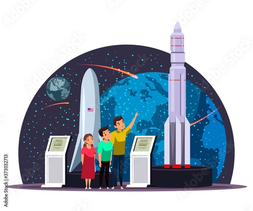 Group of children inspects stand with space rocket and shuttle