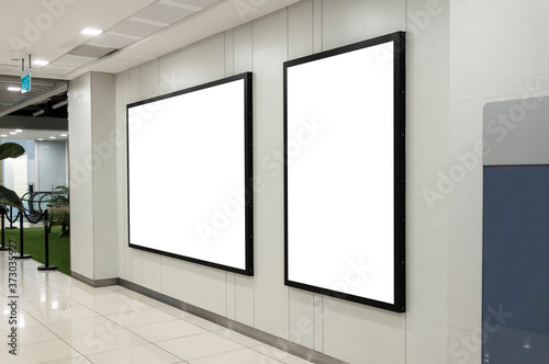 Billboard mockup inside department store. Template of an interior empty information displat, Mock-up of a shopping mall banner placeholder and poster. © Nudphon