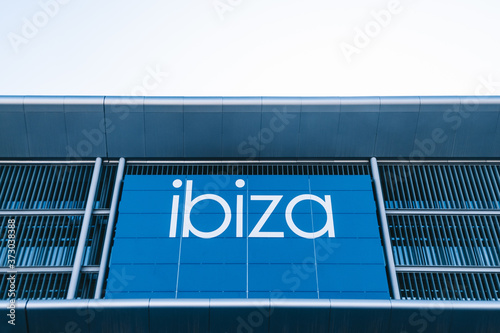 IBIZA, SPAIN - Nov 11, 2019: Ibiza airport sign with a cloudy sky background