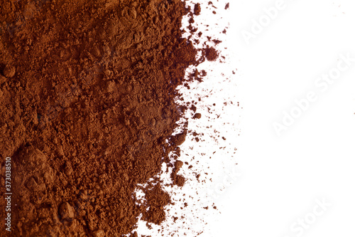 Heap of cacao powder isolated on a white background. Top view. photo