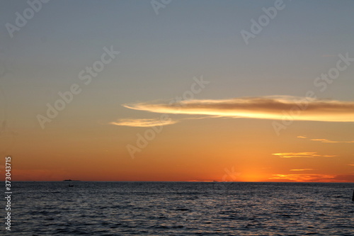 sunset over the sea © Muhardi