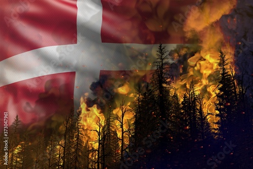 Forest fire fight concept  natural disaster - infernal fire in the woods on Denmark flag background - 3D illustration of nature