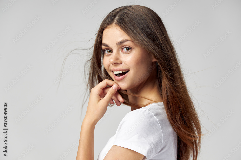 Cheerful woman white t-shirt smile emotion hand near face Cheerful woman white t-shirt smile emotion hand near face