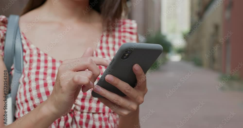Woman use of mobile phone at outdoor Woman use of mobile phone at outdoor