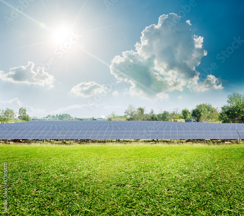 Solar farm system field in suny day and cloud green energy world