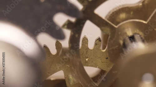 old clock mechanism with metal gears macro shot