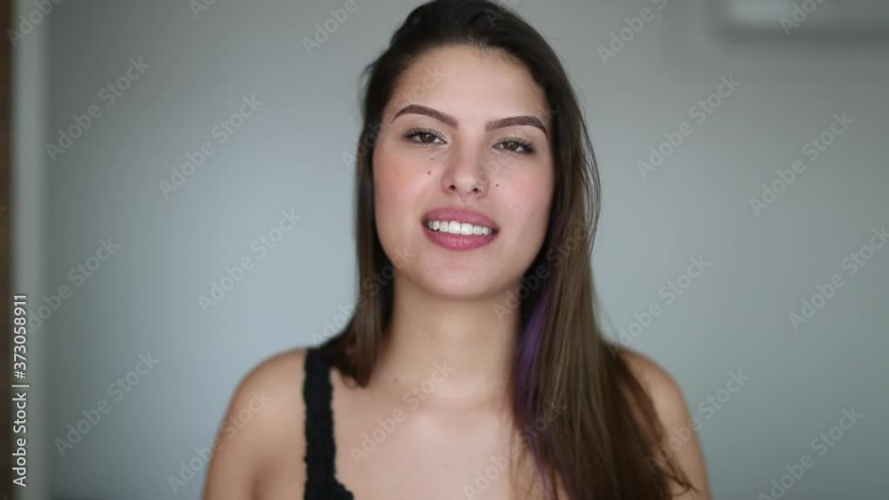 Beautiful young woman giving testimony. Pretty girl face talking to camera feeling happy Beautiful young woman giving testimony. Pretty girl face talking to camera feeling happy