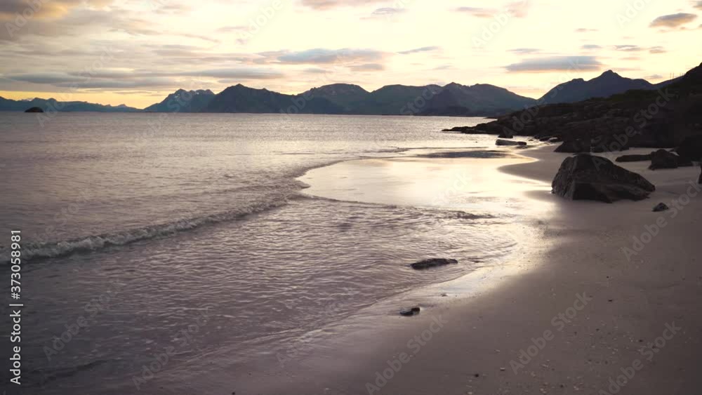 sunset with ocean waves on sandy beach, Norway sunset with ocean waves on sandy beach, Norway