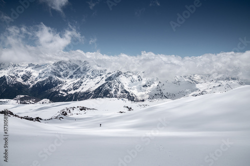 Panorama Winter snow-capped mountain peaks in Europe in the North Caucasus. Great place for winter sports. fresh snow and volcanic rocks