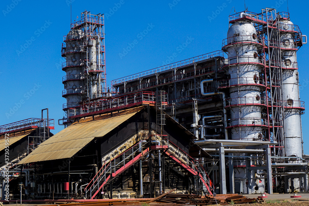 Petrochemistry. A furnace for heating oil and preparing fuels and lubricants. Chimneys from industrial furnaces. Complex for the processing of hydrocarbons at an oil refinery.