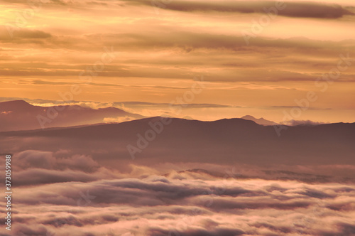 scenic view of mountain range and clouds at dawn.landscape of sea of clouds.from tsubetsu-pass,hokkaido ,japan.