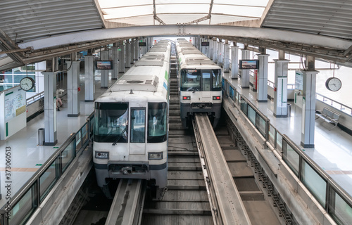 Two trains are in the subway station