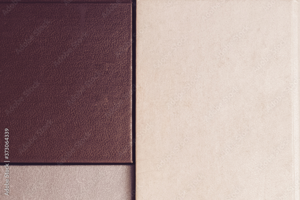 Fototapeta premium Old cover books backdrop, top view. retro book hardcovers in beige, gray and blue brown. Flat lay compisition