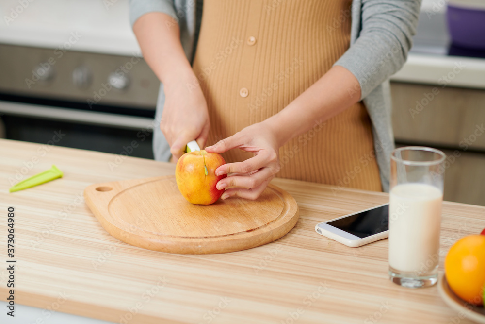 Young pregnant woman in the kitchen at home healthy snack Young pregnant woman in the kitchen at home healthy snack