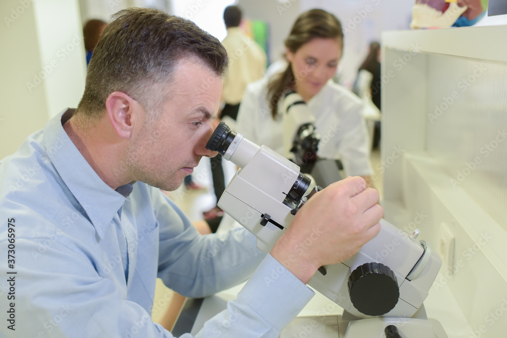 a doctor man with microscope a doctor man with microscope