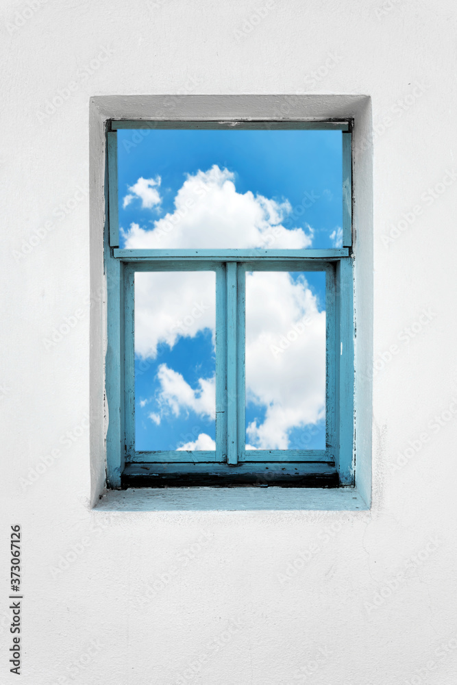 Window on a white concrete wall with blue sky and clouds view. Imagination, dreaming, freedom or inspiration concept. Window on a white concrete wall with blue sky and clouds view. Imagination, dreaming, freedom or inspiration concept.