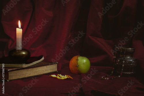 Still life with books and fruits