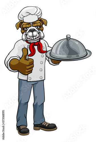 A bulldog chef mascot cartoon character holding a silver platter cloche dome of food and giving a thumbs up
