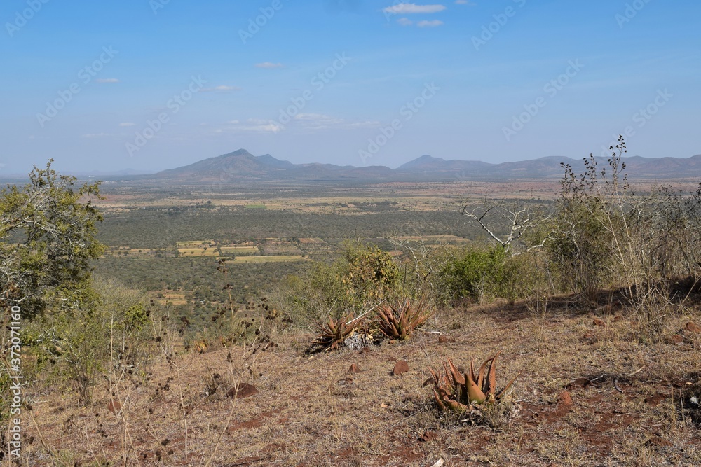 Scenic arid landscapes against sky in rural Kenya Scenic arid landscapes against sky in rural Kenya