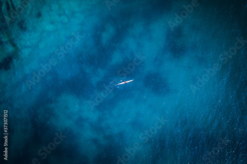 Kayak on Sydney beach with clear sea bed underwater 
