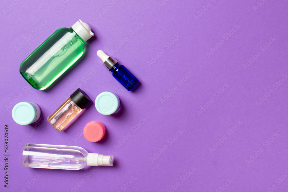 Cosmetics SPA branding mock-up, top view with copy space. set of tubes and jars of cream flat lay on colored background Cosmetics SPA branding mock-up, top view with copy space. set of tubes and jars of cream flat lay on colored background