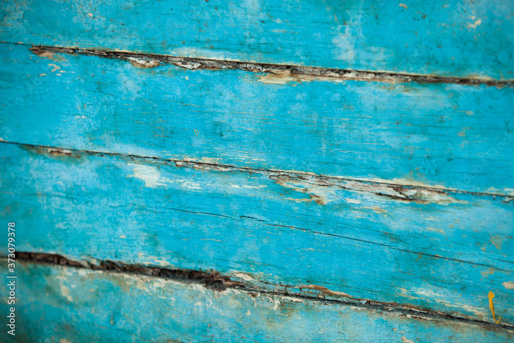 Obraz premium Vintage blue wood background texture with knots and nail holes. Old painted wood wall. Blue abstract background. Vintage wooden dark horizontal boards. Front view with copy space