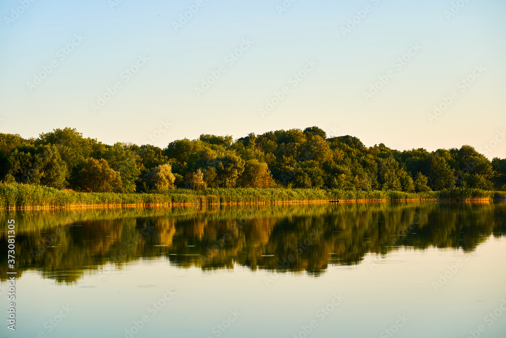 Fototapeta premium Landscape of the river and blue sky during sunset