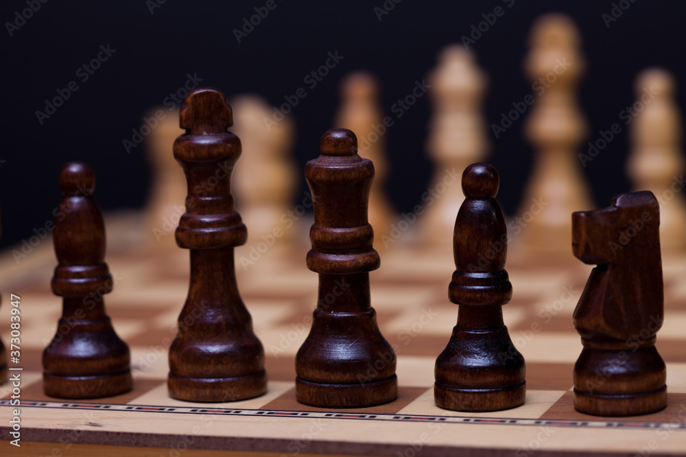 A game of chess, the beginning of a chess game two sides opposite each other. A game of chess, the beginning of a chess game two sides opposite each other.